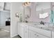 Elegant bathroom featuring double sinks, granite countertops, and designer mirrors at 292 Calm Water Way, Summerville, SC 29486