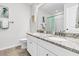 Bright bathroom featuring double sinks, granite countertops, and modern fixtures at 292 Calm Water Way, Summerville, SC 29486