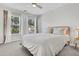 Cozy bedroom bathed in natural light from two large windows, creating a serene atmosphere at 292 Calm Water Way, Summerville, SC 29486