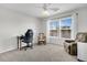 Neutral bedroom featuring large windows, a ceiling fan, and cozy seating, ideal for relaxation at 292 Calm Water Way, Summerville, SC 29486