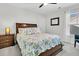 Bright bedroom with a queen-sized bed, side table, and a large window at 292 Calm Water Way, Summerville, SC 29486