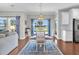 Dining area featuring view of water, stylish blue rug, modern chandelier, and seating for four people at 292 Calm Water Way, Summerville, SC 29486