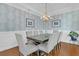 Beautiful dining room with decorative wallpaper, ample seating, and modern decor at 292 Calm Water Way, Summerville, SC 29486
