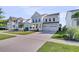 Attractive two-story home featuring a lovely porch, well-kept lawn, and colorful foliage, creating a welcoming atmosphere at 292 Calm Water Way, Summerville, SC 29486