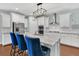 Kitchen with an island featuring bar seating, stainless steel appliances, granite countertops, and pendant lighting at 292 Calm Water Way, Summerville, SC 29486