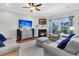 Inviting living room with plush sofas, fireplace, and scenic views from the windows at 292 Calm Water Way, Summerville, SC 29486