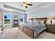 Luxurious main bedroom suite featuring a tray ceiling and serene lake views at 292 Calm Water Way, Summerville, SC 29486