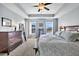 Sunlit main bedroom overlooking the lake with a spacious layout and beautiful views at 292 Calm Water Way, Summerville, SC 29486