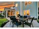 Back patio area with outdoor dining table, grill, and comfortable seating, perfect for entertaining at 292 Calm Water Way, Summerville, SC 29486