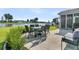 Outdoor patio featuring dining set and scenic lake views at 292 Calm Water Way, Summerville, SC 29486