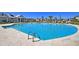 Relaxing community pool with lounge chairs, covered patio and a crystal-clear blue water, surrounded by lush landscaping at 292 Calm Water Way, Summerville, SC 29486