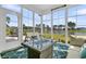 Inviting sunroom with beautiful lake views and comfortable seating area at 292 Calm Water Way, Summerville, SC 29486