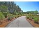 Scenic walking path through a wooded area, perfect for enjoying nature and outdoor activities at 292 Calm Water Way, Summerville, SC 29486