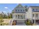Charming two-story home with a welcoming front porch, staircase and a drive-under garage at 3049 Robeson Trce, Johns Island, SC 29455