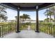 Covered balcony showcases the peaceful water view and tropical vegetation at 3121 Marshgate Dr, Seabrook Island, SC 29455