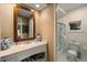 Bright bathroom featuring stone countertops, stylish mirror, tub/shower combination, and fixtures at 3121 Marshgate Dr, Seabrook Island, SC 29455