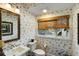 Cozy bathroom with natural light, patterned wallpaper, and elegant fixtures at 3121 Marshgate Dr, Seabrook Island, SC 29455