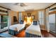 Comfortable bedroom featuring twin beds, wood floors, and natural light at 3121 Marshgate Dr, Seabrook Island, SC 29455