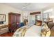 Comfortable bedroom with private balcony overlooking the water, wood floors, and furnishings at 3121 Marshgate Dr, Seabrook Island, SC 29455