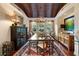 Elegant dining room featuring a wood ceiling, decorative lighting, and ample seating at 3121 Marshgate Dr, Seabrook Island, SC 29455