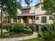 Charming home with shingle siding, a metal roof, a covered porch, and professionally landscaped front yard at 3121 Marshgate Dr, Seabrook Island, SC 29455