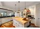 Spacious kitchen featuring a butcher block island, designer cabinets, and stainless appliances at 3121 Marshgate Dr, Seabrook Island, SC 29455