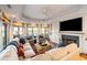 Bright living room featuring a fireplace, hardwood floors, and scenic water views at 3121 Marshgate Dr, Seabrook Island, SC 29455