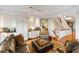 This living room features hardwood floors, built-ins, and access to the stairs at 3121 Marshgate Dr, Seabrook Island, SC 29455