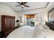 This main bedroom has a coffered ceiling, ensuite bathroom, and access to the outdoors at 3121 Marshgate Dr, Seabrook Island, SC 29455
