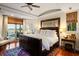 Serene main bedroom with a decorative rug, modern lighting, and water views at 3121 Marshgate Dr, Seabrook Island, SC 29455