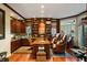 Spacious home office with wood cabinets, bookshelves, and leather chairs for a comfortable workspace at 3121 Marshgate Dr, Seabrook Island, SC 29455