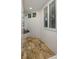 This shower features a tile surround, tile floor, and window with shutters at 3121 Marshgate Dr, Seabrook Island, SC 29455