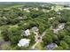 Aerial view of the neighborhood showcasing lush greenery, ponds, and tree-lined streets at 3226 Waverly Ln, Johns Island, SC 29455