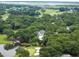Community aerial view overlooking green trees, serene pond and golf course at 3226 Waverly Ln, Johns Island, SC 29455