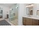 Modern bathroom featuring a walk-in glass shower, dual vanities, and contemporary finishes at 3226 Waverly Ln, Johns Island, SC 29455