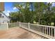 Wooden deck overlooking a lush backyard with mature trees at 3226 Waverly Ln, Johns Island, SC 29455