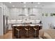 Stylish kitchen featuring stainless steel appliances, a modern island with bar seating, and elegant pendant lighting at 3226 Waverly Ln, Johns Island, SC 29455
