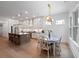 Well-appointed kitchen with stainless steel appliances, ample cabinet space, and a connected dining area for seamless entertaining at 3226 Waverly Ln, Johns Island, SC 29455