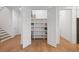Large walk-in pantry with custom shelving for ample food and storage organization at 3226 Waverly Ln, Johns Island, SC 29455