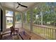 Relaxing screened-in porch with wooden furniture, ceiling fan, and beautiful views of the landscaped backyard at 3226 Waverly Ln, Johns Island, SC 29455