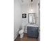 Stylish powder room with wood flooring, striking vanity and pendant lighting at 3226 Waverly Ln, Johns Island, SC 29455