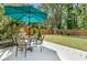 Manicured backyard featuring a patio with an umbrella and outdoor seating at 3257 Heathland Way, Mount Pleasant, SC 29466