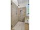 Bathroom features a tiled walk-in shower with glass door and a soaking tub under a window at 3257 Heathland Way, Mount Pleasant, SC 29466