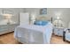 Comfortable bedroom with a metal bed frame, white bedding, and a light wood floor at 3257 Heathland Way, Mount Pleasant, SC 29466