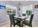 Dining area with view of a sunroom that allows for plenty of natural lighting at 3257 Heathland Way, Mount Pleasant, SC 29466