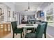 View of dining area showcases pendant lighting and a stainless steel refrigerator in the kitchen at 3257 Heathland Way, Mount Pleasant, SC 29466