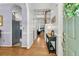Inviting entryway featuring hardwood floors, stylish console table, and seamless flow to the kitchen and living areas at 3257 Heathland Way, Mount Pleasant, SC 29466