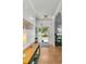 Welcoming entryway with hardwood floors, stylish console table, and view to the landscaped front yard at 3257 Heathland Way, Mount Pleasant, SC 29466