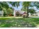 Traditional brick home with mature trees, green lawn, and well-maintained landscaping at 3257 Heathland Way, Mount Pleasant, SC 29466