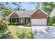 Charming brick home with well-manicured landscaping, front lawn, and attached garage at 3257 Heathland Way, Mount Pleasant, SC 29466